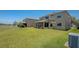 Expansive backyard with lush green lawn and well-maintained landscaping, perfect for outdoor activities and entertaining at 632 Tanana Fall Dr, Ruskin, FL 33570
