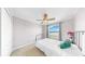 Cozy bedroom with a comfortable bed, neutral decor, and a scenic window view at 632 Tanana Fall Dr, Ruskin, FL 33570