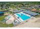 Aerial view of a vibrant community pool and recreation area with seating and a splash pad at 632 Tanana Fall Dr, Ruskin, FL 33570