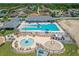 Aerial view featuring community pool with splash pad, sun loungers, and seating areas at 632 Tanana Fall Dr, Ruskin, FL 33570