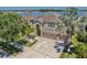 Stunning two-story home with well-maintained landscaping and a three-car garage, located near a lake at 632 Tanana Fall Dr, Ruskin, FL 33570