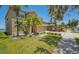 Charming home with a well-manicured lawn and tropical landscaping, complemented by a three-car garage at 632 Tanana Fall Dr, Ruskin, FL 33570