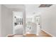 Bright upstairs hallway with wood floors and elegant chandelier at 632 Tanana Fall Dr, Ruskin, FL 33570