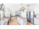 Open-concept kitchen boasts an island, stainless appliances, and seamless flow into the living area at 632 Tanana Fall Dr, Ruskin, FL 33570