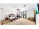 Serene bedroom with carpet, a decorative bed frame, natural light, and ample space for relaxation at 632 Tanana Fall Dr, Ruskin, FL 33570
