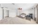 Main bedroom featuring plush carpeting, ceiling fan, and ample space at 632 Tanana Fall Dr, Ruskin, FL 33570