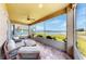 Inviting screened patio with comfortable seating and views of the lake at 632 Tanana Fall Dr, Ruskin, FL 33570