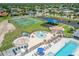 Aerial view showcases a community park with tennis, playground, splashpad, and seating at 632 Tanana Fall Dr, Ruskin, FL 33570