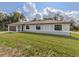 Well-maintained home featuring a neat lawn, an attached garage, and a freshly painted exterior at 6497 Honeycomb Cir, North Port, FL 34291