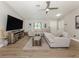 Spacious living room offering a large sectional sofa, stylish décor, and a welcoming atmosphere at 6497 Honeycomb Cir, North Port, FL 34291