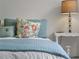 Cozy bedroom detail featuring a floral pillow and a stylish bedside lamp, perfect for a relaxing retreat at 678 Clear Creek Dr, Osprey, FL 34229