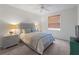 This warm, cozy bedroom features soft, neutral colors and a comfortable queen bed at 678 Clear Creek Dr, Osprey, FL 34229