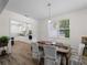 Dining room open to the bright kitchen with stainless steel appliances at 678 Clear Creek Dr, Osprey, FL 34229