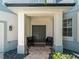 Inviting front entrance featuring a double door, charming decor, and tasteful landscaping that enhances curb appeal at 678 Clear Creek Dr, Osprey, FL 34229