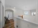 Upstairs hallway with seating and views to a bedroom and the window at 678 Clear Creek Dr, Osprey, FL 34229