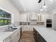 Bright kitchen featuring granite countertops, a center island, and stainless steel appliances at 678 Clear Creek Dr, Osprey, FL 34229