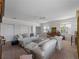Spacious living room with neutral carpeting, couches and a ceiling fan for added comfort at 678 Clear Creek Dr, Osprey, FL 34229