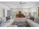 Inviting living room with cozy sofas, accent pillows, area rug, and bright windows offer a great space to relax at 678 Clear Creek Dr, Osprey, FL 34229
