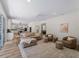 Open-concept living room and kitchen showcasing modern décor, wood floors, and neutral accents at 678 Clear Creek Dr, Osprey, FL 34229