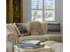 Comfortable living room features bright light from the window and a beautiful curio cabinet at 678 Clear Creek Dr, Osprey, FL 34229