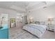 Spacious main bedroom features a tray ceiling, walk-in closets, and a private sitting area at 678 Clear Creek Dr, Osprey, FL 34229