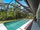 This screened pool features a covered lanai, perfect for entertaining and relaxing in the Florida sunshine at 678 Clear Creek Dr, Osprey, FL 34229