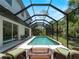 Enjoy this screened-in pool with ample space for patio furniture and relaxation at 678 Clear Creek Dr, Osprey, FL 34229