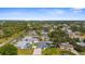 Aerial view of the neighborhood with lush greenery, houses, and community streets at 755 Mohawk Rd, Venice, FL 34293