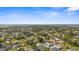 Beautiful aerial view overlooking a neighborhood with palm trees and blue skies at 755 Mohawk Rd, Venice, FL 34293