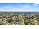 Panoramic aerial view of a residential neighborhood, revealing the ocean in the distance at 755 Mohawk Rd, Venice, FL 34293