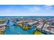 Panoramic aerial view of a charming coastal city featuring a waterway, a bridge, and colorful buildings at 755 Mohawk Rd, Venice, FL 34293
