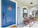 Inviting front porch with seating area and welcome sign, enhancing the home's appeal at 755 Mohawk Rd, Venice, FL 34293