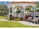 Tranquil gazebo in the park, with well manicured landscaping and pathways at 755 Mohawk Rd, Venice, FL 34293