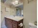 Bathroom with wood vanity, marble countertop, decorative lighting, and a view at 821 Waterside Dr # 106, Venice, FL 34285