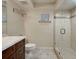A full bathroom with a sleek glass shower and modern fixtures at 821 Waterside Dr # 106, Venice, FL 34285