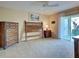Inviting bedroom with a view to the outside and warm natural light at 821 Waterside Dr # 106, Venice, FL 34285