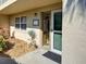 Charming condo entrance with lush landscaping and decorative welcome sign adding curb appeal at 821 Waterside Dr # 106, Venice, FL 34285