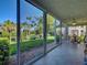 Relaxing lanai area with scenic views, comfortable seating, and sliding glass doors at 821 Waterside Dr # 106, Venice, FL 34285