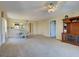 Open living room with a view into the dining area and updated fixtures at 821 Waterside Dr # 106, Venice, FL 34285