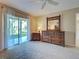 Bright main bedroom featuring elegant furniture and access to the outdoors at 821 Waterside Dr # 106, Venice, FL 34285