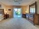 Spacious main bedroom with sliding glass door, ample natural light, and stylish furnishings at 821 Waterside Dr # 106, Venice, FL 34285