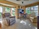 Comfortable home office with an abundance of natural light and peaceful views at 821 Waterside Dr # 106, Venice, FL 34285