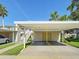 Assigned, covered parking for residents within the community featuring an easy access stairway at 821 Waterside Dr # 106, Venice, FL 34285