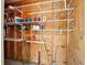 Wood paneled storage space with wire shelving and organized items at 821 Waterside Dr # 106, Venice, FL 34285