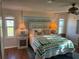 Bright bedroom features a decorative headboard and windows, creating a cozy and inviting space at 902 Jolanda Cir, Venice, FL 34285