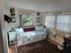 Cozy bedroom featuring a daybed with comfortable pillows and decor at 902 Jolanda Cir, Venice, FL 34285