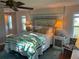 Comfortable bedroom features a ceiling fan and attached bathroom, providing convenience and relaxation at 902 Jolanda Cir, Venice, FL 34285
