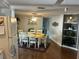 Cozy dining area with a spacious table setting, lovely decor, and natural light at 902 Jolanda Cir, Venice, FL 34285