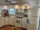Well-lit kitchen with modern appliances, plenty of counter space, and a window view at 902 Jolanda Cir, Venice, FL 34285