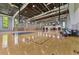 Full-sized indoor basketball court perfect for recreational play and fitness activities with ample lighting at 9048 Luna Ln, Sarasota, FL 34241